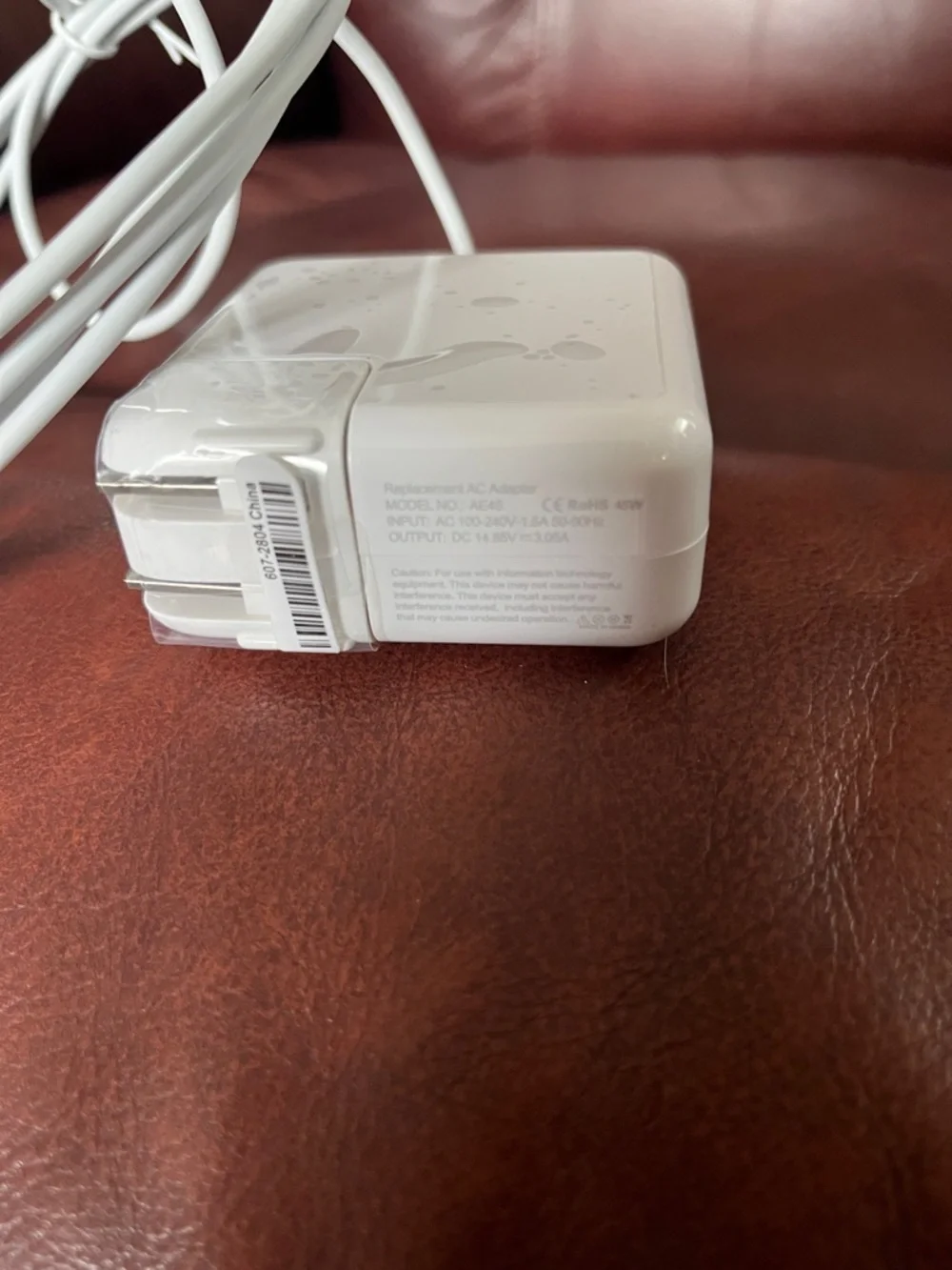 White Laptop Power Adapter with Attached Charging Cable